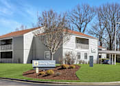 Thumbnail 18 of 19 - A building with a sign that says Leasing Office.