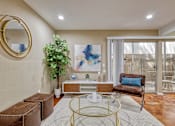 Thumbnail 7 of 17 - Living room or nook area with concrete floors and a sliding glass door to a fenced patio