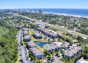 Thumbnail 20 of 26 - A bird's eye view of a residential area with a road running through it.