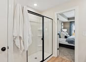 Thumbnail 34 of 37 - A white towel is hanging on a black door.