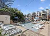 Thumbnail 5 of 26 - A pool area with sun loungers and a sign that says 'No Diving'.