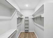 Thumbnail 38 of 45 - A white room with a ladder in the middle of it.