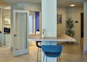 Thumbnail 17 of 27 - A modern dining room with a table and chairs.