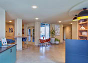Thumbnail 21 of 27 - A modern interior with a reception desk and seating area.