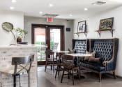 Thumbnail 6 of 31 - Resident Lounge Area with Kitchen and Seating