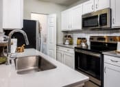 Thumbnail 10 of 31 - Model Apartment Home Kitchen