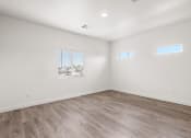 Thumbnail 6 of 24 - an empty room with white walls and a window