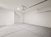 Thumbnail 20 of 24 - an empty room with white walls and a cement floor