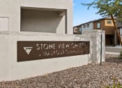 Thumbnail 24 of 24 - a building with a stone view on a battleground community sign