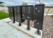 Thumbnail 19 of 46 - a row of mailboxes on a concrete pedestal on a sidewalk