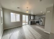 Thumbnail 36 of 46 - an empty living room and kitchen in a new home