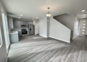 Thumbnail 35 of 46 - an empty living room and kitchen in a new home