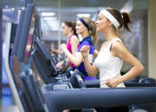Thumbnail 17 of 24 - three women running on cardio machines at the gym