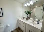 Thumbnail 37 of 46 - an empty bathroom with a sink and a mirror