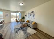 Thumbnail 3 of 46 - a living room with a couch and a coffee table