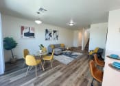 Thumbnail 5 of 46 - a living room and dining room with a table and chairs