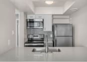 Thumbnail 7 of 30 - a kitchen with stainless steel appliances and a sink