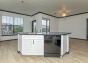 Thumbnail 19 of 29 - a kitchen with an island and a large window