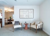 Thumbnail 42 of 44 - a living room with two chairs and a table