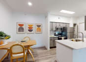 Thumbnail 3 of 22 - a kitchen and dining room with a table and chairs
