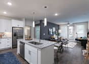 Thumbnail 3 of 47 - A modern kitchen with white cabinets and a large island.