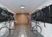 Thumbnail 22 of 22 - a room with two bikes hanging from the ceiling in a building