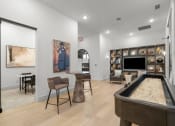 Thumbnail 35 of 47 - a living room with a pool table and a television