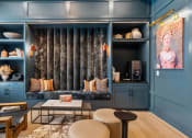Thumbnail 21 of 47 - a living room with blue walls and a couch and blue cabinets