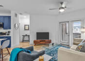 Thumbnail 4 of 47 - a living room with a couch and a tv