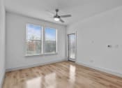 Thumbnail 26 of 47 - the living room of an empty home with white walls and wood floors