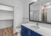 Thumbnail 28 of 47 - a bathroom with a sink and a mirror