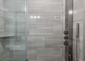 Thumbnail 40 of 47 - a bathroom with a shower and a glass door