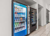 Thumbnail 30 of 47 - a refrigerator with soda and drinks in a lobby