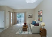 Thumbnail 4 of 21 - a living room with a couch and a coffee table