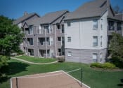 Thumbnail 16 of 21 - a tennis court at the whispering winds apartments in pearland, tx