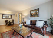 Thumbnail 1 of 35 - a living room with leather couches and a coffee table