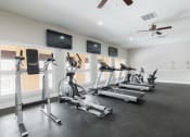 Thumbnail 25 of 32 - the gym is equipped with treadmills and other exercise equipment