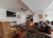 Thumbnail 18 of 32 - a living room with leather furniture and a tv