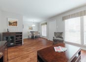 Thumbnail 6 of 32 - a view of the living room from the dining room and kitchen of an apartment