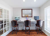 Thumbnail 33 of 54 - A room with a desk and two chairs.