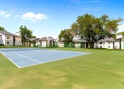 Thumbnail 12 of 16 - tennis court at the whispering winds apartments in pearland, tx