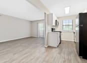 Thumbnail 6 of 16 - a kitchen and living room in a 555 waverly unit