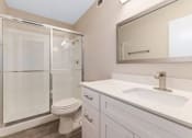 Thumbnail 8 of 16 - a bathroom with a toilet sink and shower