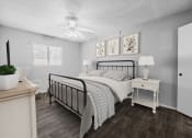 Thumbnail 2 of 17 - a bedroom with a bed and a ceiling fan