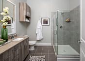 Thumbnail 7 of 30 - restroom entrance with beautiful shower scene