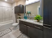 Thumbnail 8 of 25 - a bathroom with a sink and a toilet and a shower