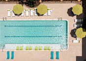 Thumbnail 21 of 25 - a rendering of a pool with umbrellas and chairs around it
