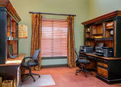 Thumbnail 27 of 35 - a home office with a desk and a window