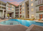 Thumbnail 16 of 22 - a swimming pool in the middle of an apartment building
