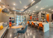 Thumbnail 9 of 22 - Clubhouse lounge area with seating and desk/chairs